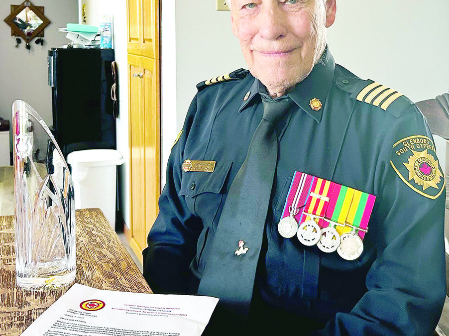 Garth McIntyre honoured with rare coin commemorating Lifetime Achievement Award